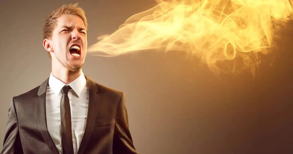 A man is spitting fire.