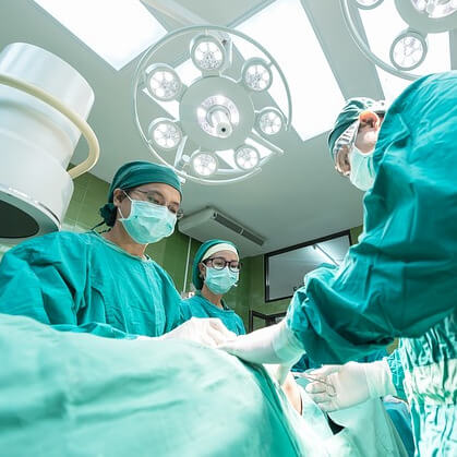 Three surgeons at an operation table.