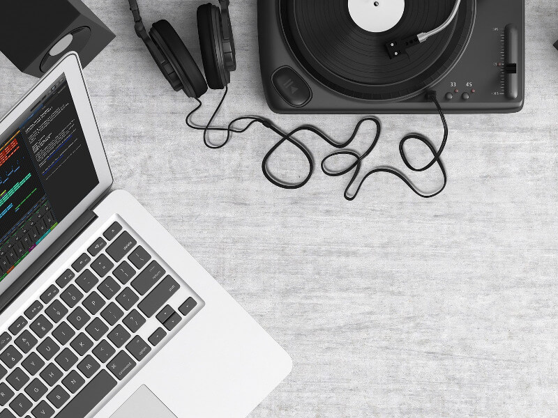 Generating music with a laptop and a record player.